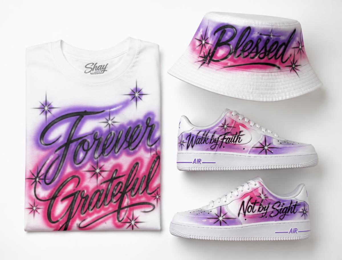 Custom airbrushed t-shirt, bucket hat and sneakers on a white studio background