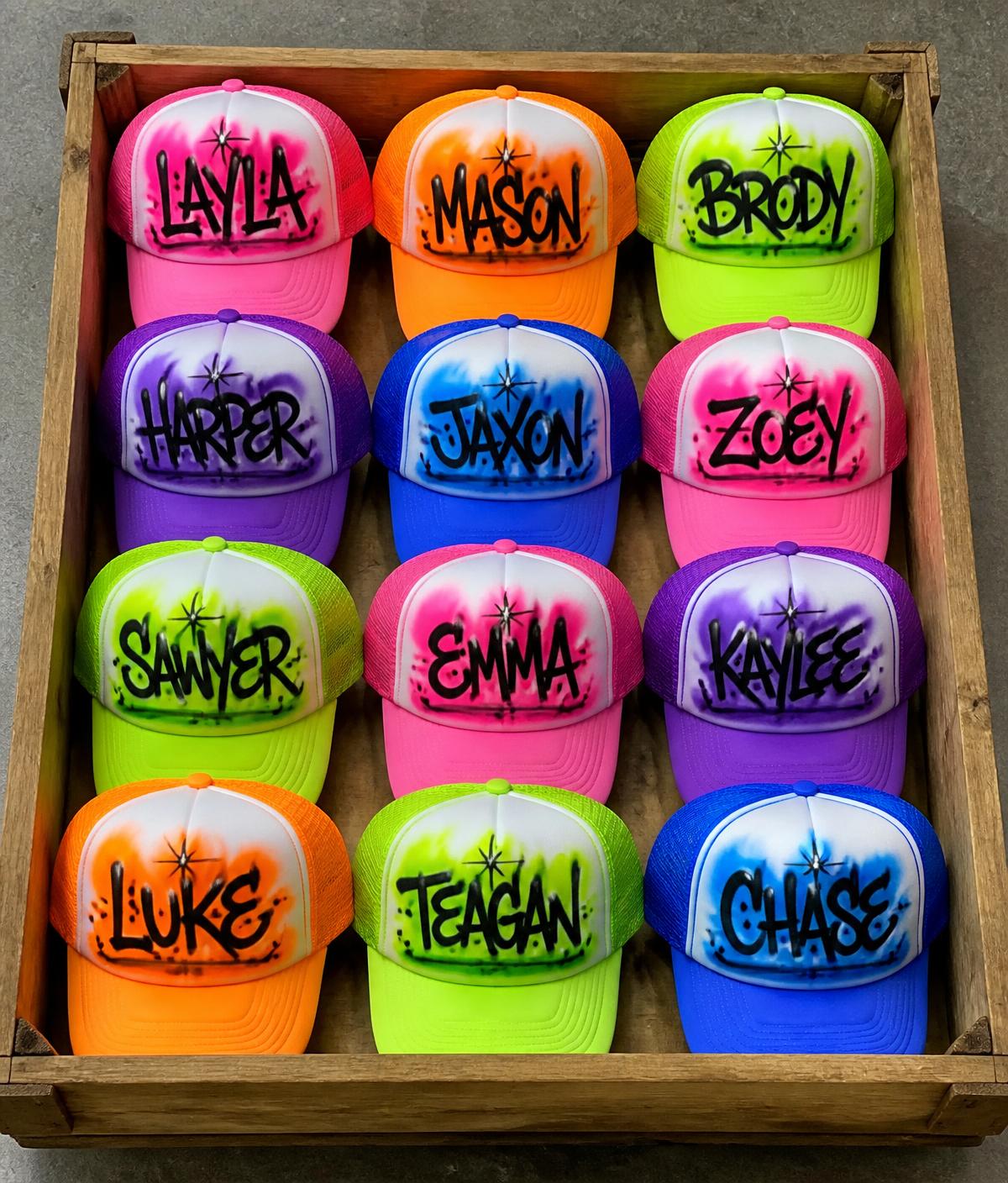 Crate full of neon airbrushed trucker hats with custom names