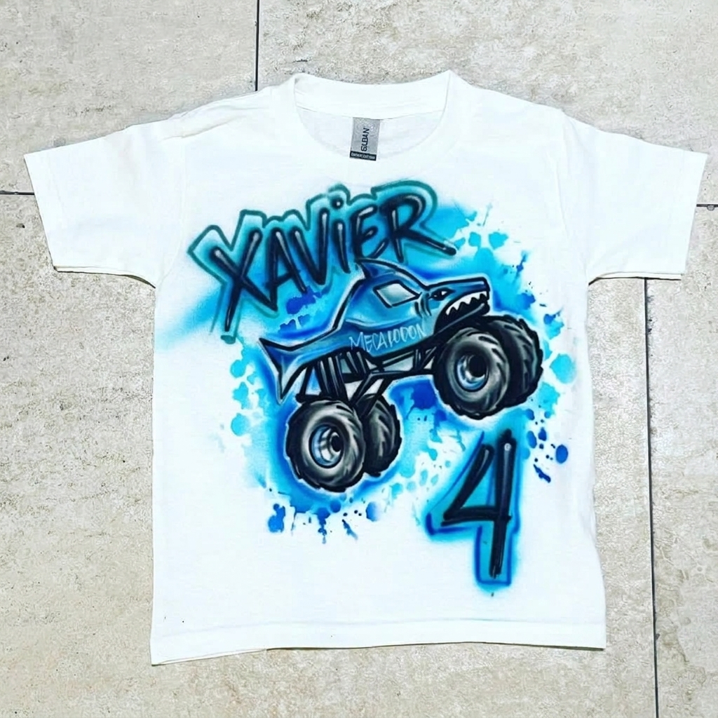 Celebration-Grade Megalodon Monster Truck Tee — custom airbrush spray paint design on shirts, hats, shoes and outfits